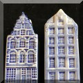 K36. Two sets of Delft house salt and pepper. - $12 each 